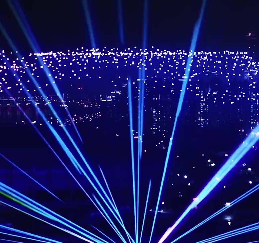 Drone light show with lasers